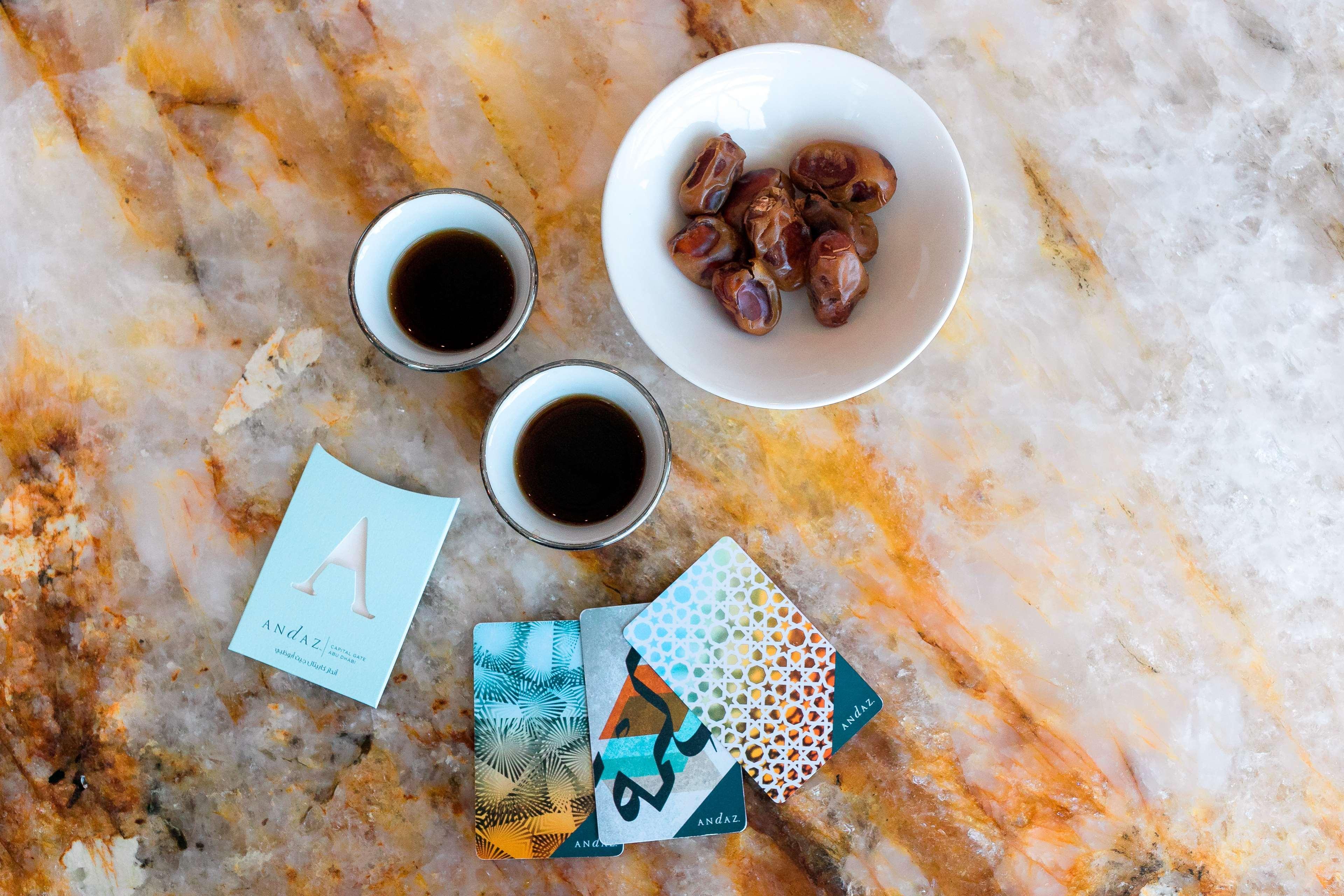 Hotel Andaz Capital Gate Abu Dhabi, By Hyatt Esterno foto A cup of coffee with a bowl of dates